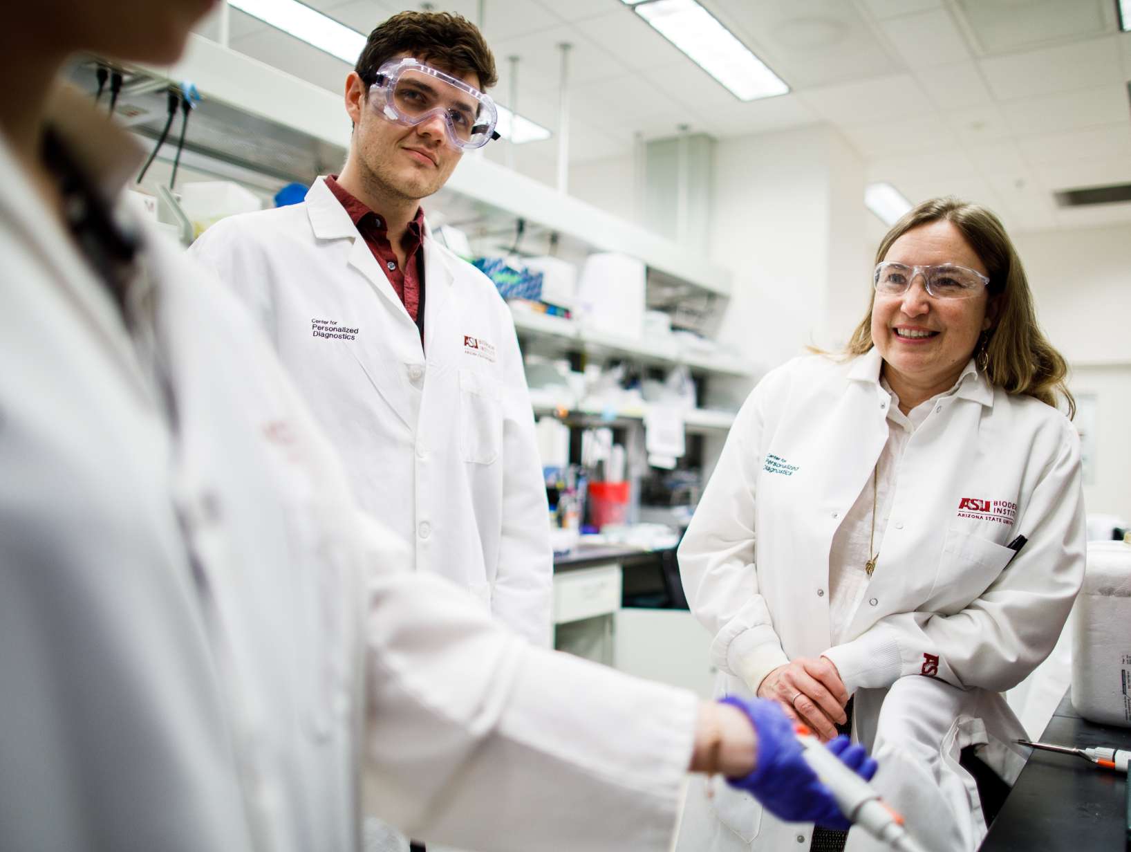 Man and woman standing in a laboratory.