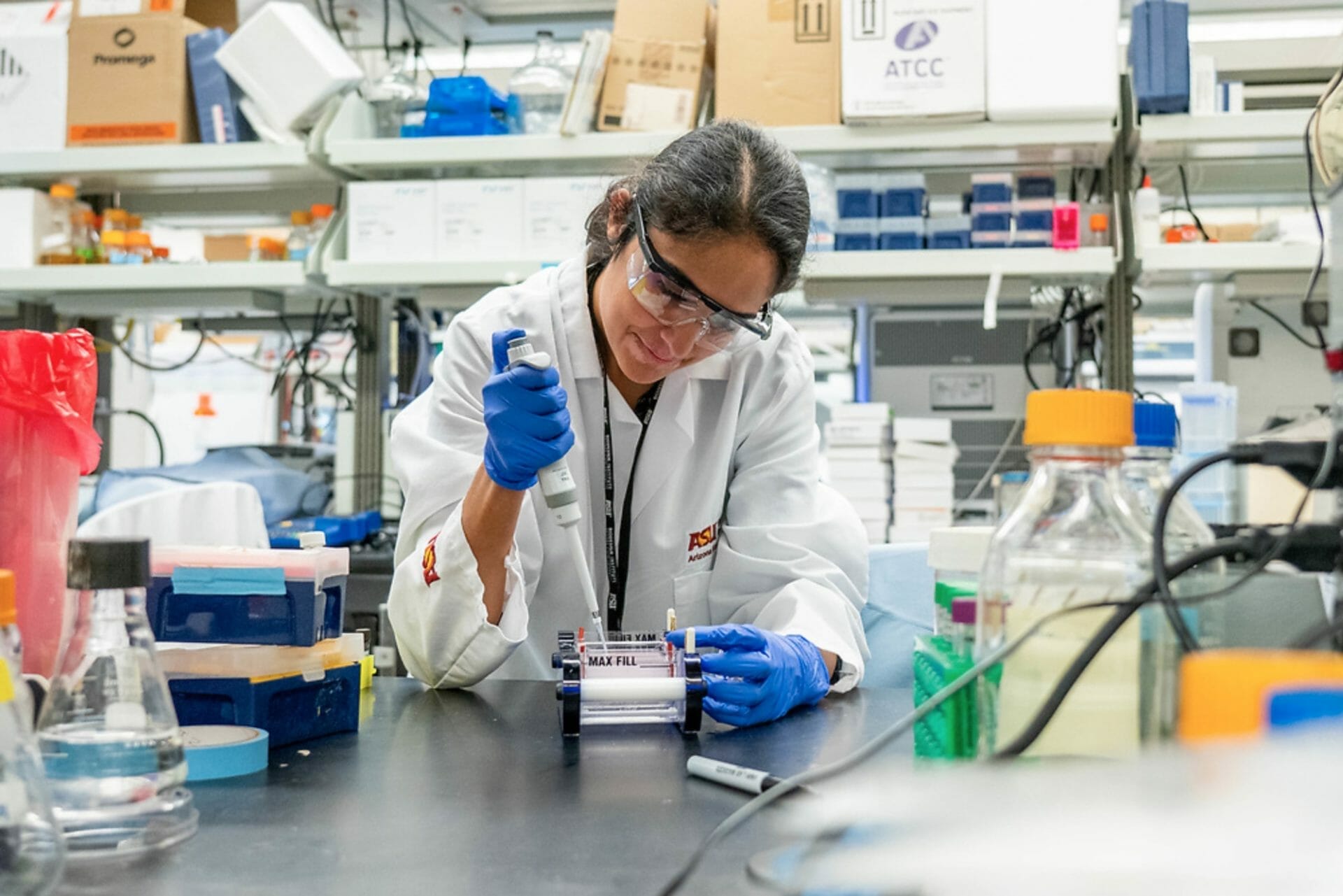 Research Specialist Ami Gutierrez-Jensen uses a pipette at the Center for Immunotherapy, Vaccines and Virotherapy in Tempe on April 15, 2022. (Photo by Samantha Chow/ASU)